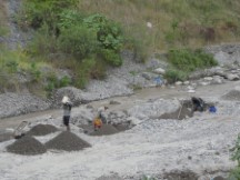 People sorting gravel (Common on rivers) near Panajachel, Guatemala.