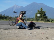 Ted with his bike and Volcanos in background near Antigua, Guatemala.