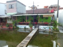 Flooded street in front of restaurant in Flores, Guatemala.