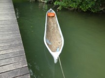 Dug out log boat on the Rio Dulce between the town of Rio Dulce and Livingston, Guatemala.