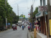 The main street (highway GA13) in the town of Rio Dulce, Guatemala.