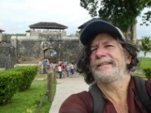 Ted in front of Castillo De San Felipe on the shore of Lago De Izabal near Rio Dulce, Guatemala.