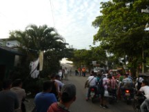 The police have highway GA13 closed for a parade at the bridge near Rio Dulce, Guatemala.