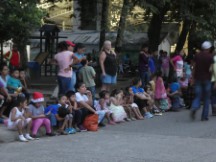 Children waiting for the parade to go through Rio Dulce, Guatemala.