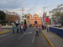 Some sort of a ceremony originating from the Parish church (Iglesia Parroquial) in San Jorge, Nicaragua.