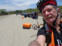 Ted with his bike at the end of the line at the border to go from Nicaragua to Costa Rica.