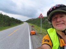 Ted with his bike on highway south of Skaidi.