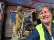 Ted in front of taxidermy bear at Sannan Putiikki gift store in Kätkäsuvanto, Finland.