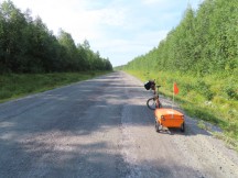 Ted’s bike on dirt road in Sweden, just north of Artic Circle.