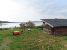 Picnic table on shore of a remote lake in Sweden.