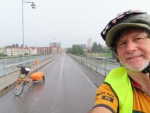 Ted with his bike on bridge used to exit city of Skellefteå, Sweden.
