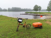 Ted’s bike in front of the lake at Sanabadets campground in Sweden.