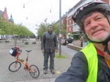 Ted with his bike at Standing Man statue in Umeå, Sweden.