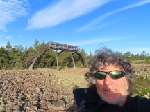 Ted with viewing tower behind him at Norrfällsviken nature area near campground at Norrfällsviken, Sweden.