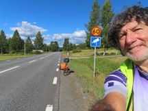 Ted near sign warning about the previous photo’s speed camera on highway 331 between Åsäng, Sweden and Sörberge, Sweden.