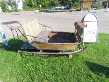 Sled in front of Postnord Postombud in Bergsjö, Sweden.