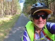 Ted cycling on bike trail between Christdorf and Kyritz, Germany.
